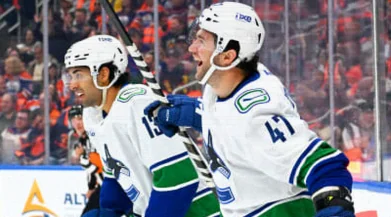 Paul Cotter Lifts Canucks Past Oilers in OT After Late Collapse