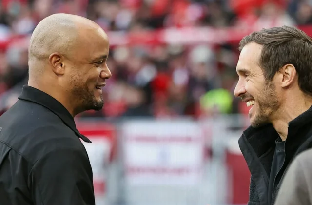 Julian Schuster Congratulates Bayern Coach Vincent Kompany