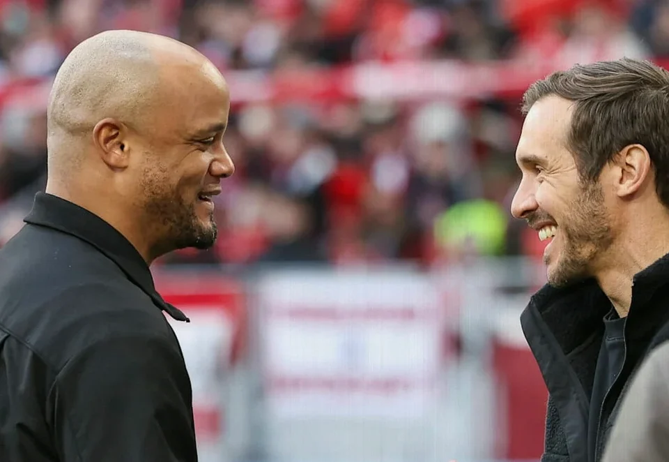 Julian Schuster Congratulates Bayern Coach Vincent Kompany