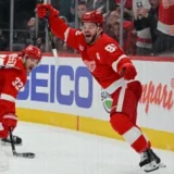 Lucas Raymond Lifts Red Wings Past Sharks in Shootout Thriller