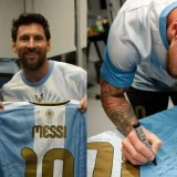 Lionel Messi Presents Signed Argentina Shirt to River Plate Fans