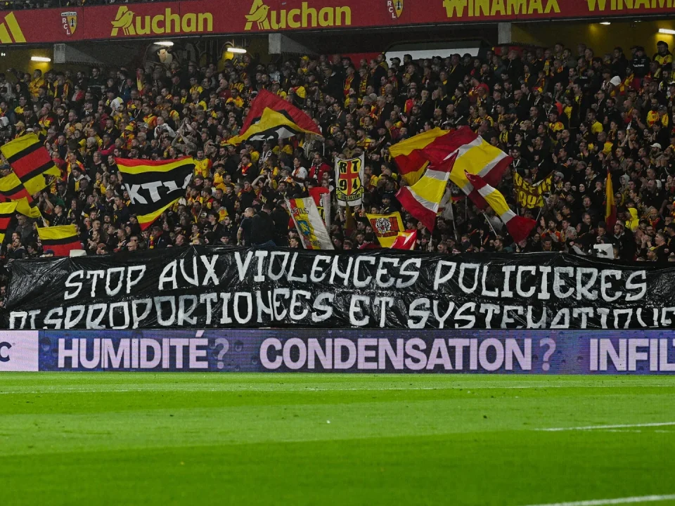 Lens Supporters Unveil Anti-Police Violence Banner During Lyon Match